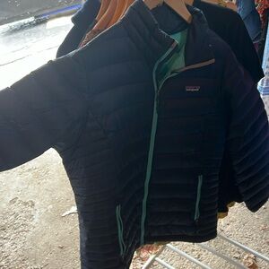 Dark blue with a teal inside. Zippered pockets